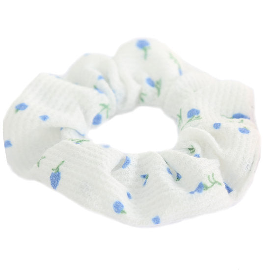 Valkoinen hiusdonitsi puuvillaa kukkaprintillä.