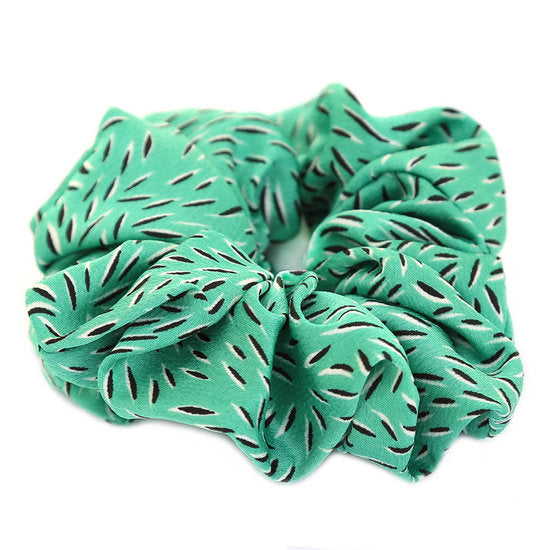 Vihreä hiusdonitsi viidakko-kuosilla.