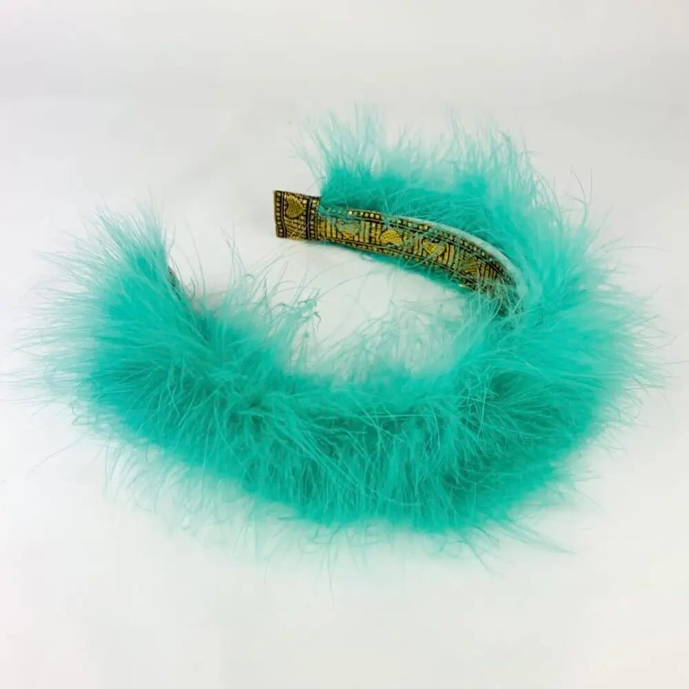 Lila Boutique Höyhen hiuspanta vihreässä värissä.